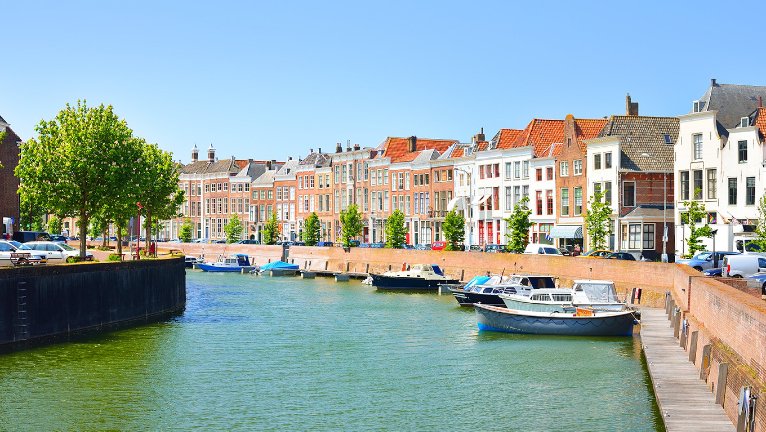 View of Middelburg with beautiful houses and boats along the canal.