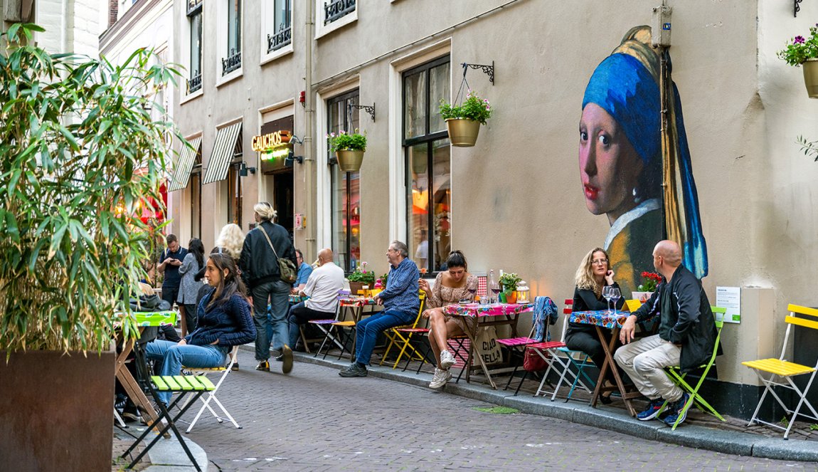 Mural of the Girl with the Pearl Earring by Johannes Vermeer on facade in Oude Molstraat The Hague