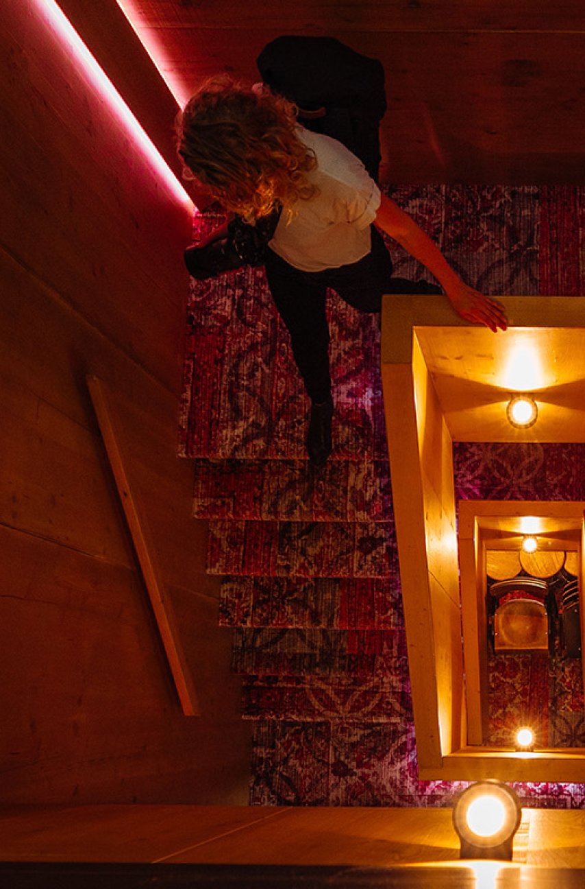 Lady walks down hotel stairs Utrecht